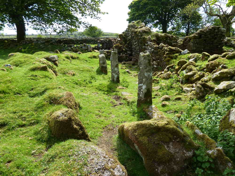 Granite posts that appear to run down the centre of a building? Note the notches in the post tops