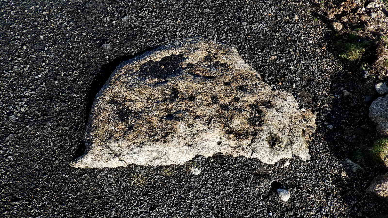 The first of two drill testing stones embedded in the track,  this one is located at SX 56618 74485