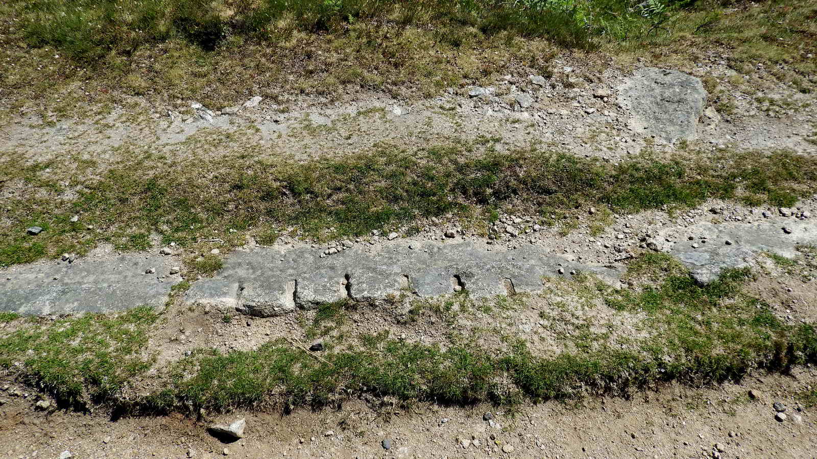 Unusual granite rail showing tare and feather marks. These are usually placed down, so one supposes this has them on both sides