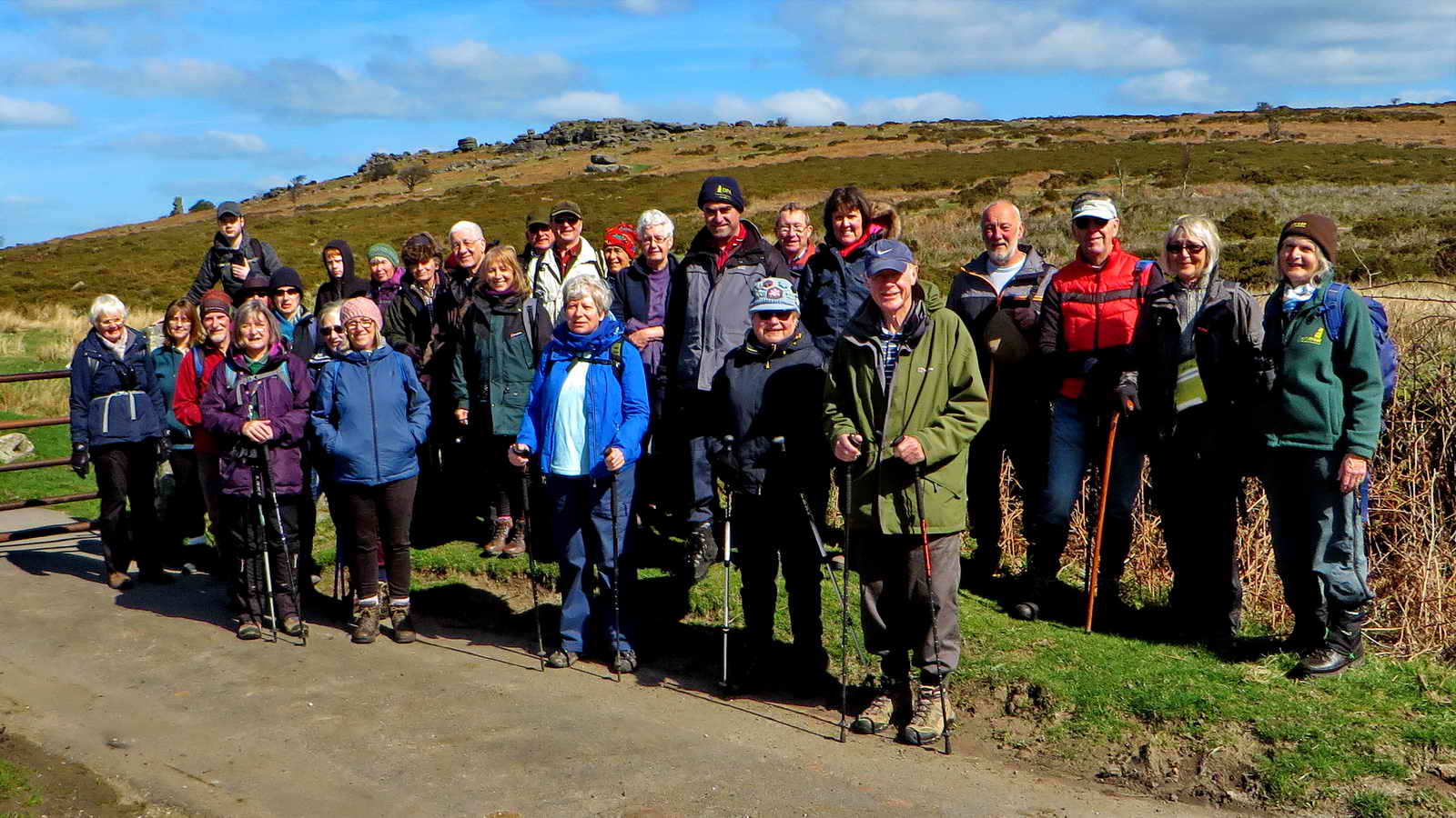 Walking group at Moyle’s Gate: Bowerman’s Nose can be seen on the skyline above the people at the left of the group.