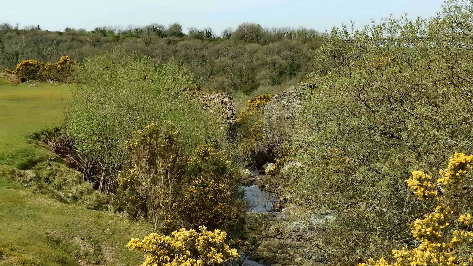 A short distance down the Red-a-Ven Brook from the buildings are the ruins of the piers of a bridge which once spanned the brook and which carried a short tramway from the quarry to the now-disappeared works