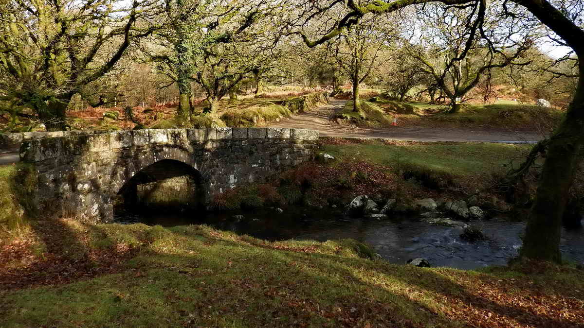 Norsworthy Bridge over the River Meavy, at “the far end” of Burrator Reservoir. A part of the car park is seen across the river and the track up to Crazy Well Pool