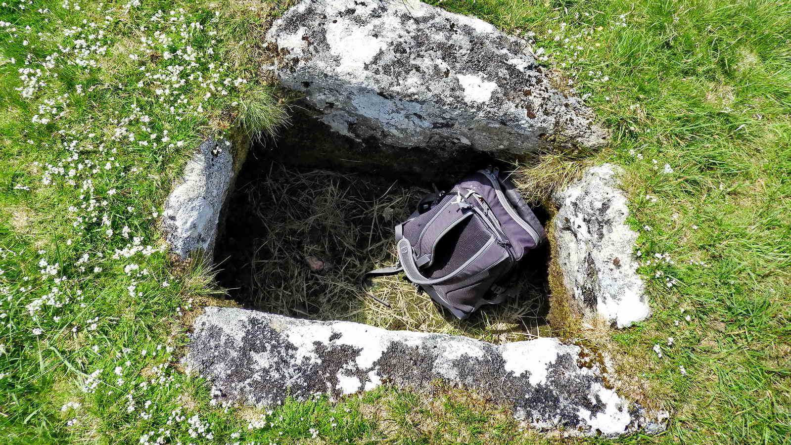 Not gold, but a standard backpack for scale. The cist is approximately 0.74 meters (2'5") deep