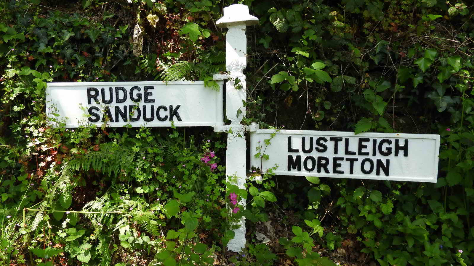 Old iron road sign