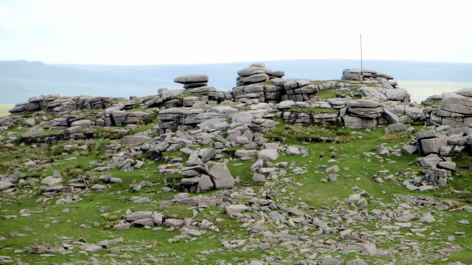 Roos Tor to the North, showing the military flag pole, which flies red colours when live firing is in progress on the Merrivale Firing Range