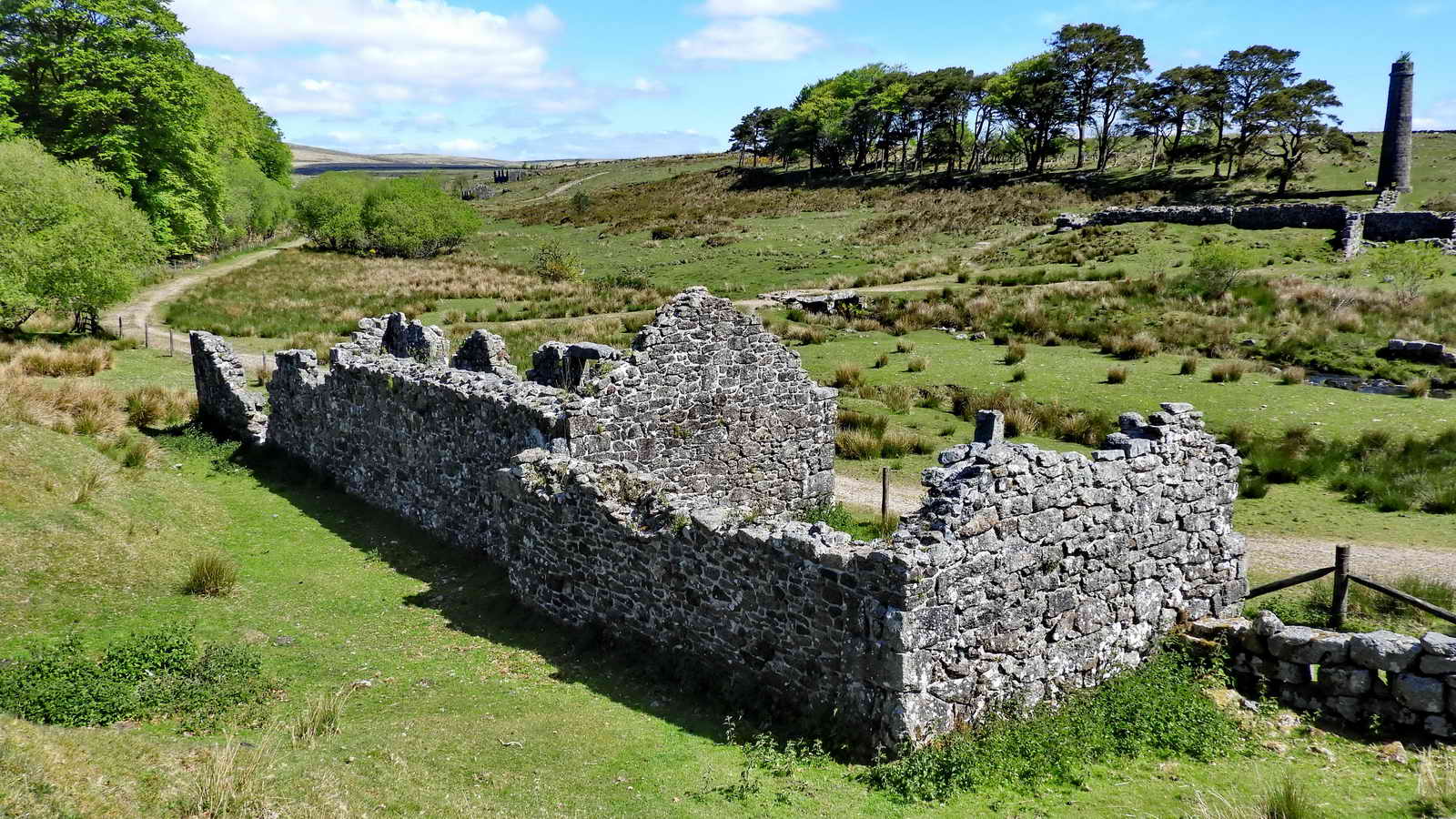 A last view of 2 (17) Watch House / Cartridge Press House / Store, with the South Chimney and its associated buildings across the Cherry Brook. The South Chimney and the track coming across the Cherry Brook with its clapper bridge are visible in the background